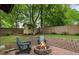 Inviting backyard with a brick fire pit and Adirondack chairs for outdoor enjoyment at 206 Flora Ne Ave, Atlanta, GA 30307
