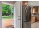 Kitchen door opens to backyard with deck and spacious lawn perfect for outdoor entertaining and relaxation at 206 Flora Ne Ave, Atlanta, GA 30307