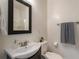 Bright bathroom boasts a sleek vanity, framed mirror, and shower with white tiles for a modern and clean design at 206 Flora Ne Ave, Atlanta, GA 30307
