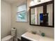 Bathroom featuring a dark vanity, and modern fixtures at 206 Flora Ne Ave, Atlanta, GA 30307