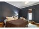 Cozy bedroom with blue walls, comfy bed, ceiling fan and natural light at 206 Flora Ne Ave, Atlanta, GA 30307