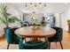 Bright dining area featuring a round table with emerald green chairs and natural light at 206 Flora Ne Ave, Atlanta, GA 30307