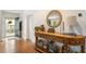 Inviting entryway with hardwood floors, a stylish console table, and seamless access to the home's layout at 206 Flora Ne Ave, Atlanta, GA 30307