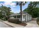 Charming home featuring a covered front porch, with lush landscaping and a private driveway at 206 Flora Ne Ave, Atlanta, GA 30307