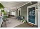 Inviting covered porch with seating, creating a cozy outdoor space to enjoy the neighborhood views at 206 Flora Ne Ave, Atlanta, GA 30307