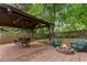Outdoor entertainment: A gazebo with a dining set and a fire pit offers an inviting space for gatherings at 206 Flora Ne Ave, Atlanta, GA 30307