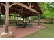 Gazebo with a dining table and fire pit provide an ideal setting for outdoor gatherings and relaxation at 206 Flora Ne Ave, Atlanta, GA 30307