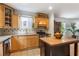 Well-lit kitchen with stainless steel range, wood cabinets, and granite countertops at 206 Flora Ne Ave, Atlanta, GA 30307