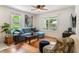 Bright and airy living room featuring hardwood floors, cozy furniture, and ample natural light at 206 Flora Ne Ave, Atlanta, GA 30307