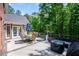 Relax on the back deck with outdoor dining and enjoy the peaceful view of mature trees at 213 Shady Valley Dr, Carrollton, GA 30116