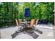 Enjoy outdoor dining on this composite deck, complete with grill and views of mature trees at 213 Shady Valley Dr, Carrollton, GA 30116