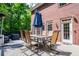 Great outdoor dining area and composite deck overlooks the mature trees in the backyard at 213 Shady Valley Dr, Carrollton, GA 30116