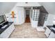 A spacious bathroom boasts dual vanities, shower with glass block, and wood-look tile flooring at 213 Shady Valley Dr, Carrollton, GA 30116