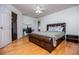 Spacious bedroom boasts hardwood floors, a leather bed frame, and a dedicated desk area at 213 Shady Valley Dr, Carrollton, GA 30116