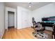 Bedroom with wood floors and ceiling fan with an open doorway to another room at 213 Shady Valley Dr, Carrollton, GA 30116