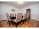 Cozy dining room with hardwood floors, classic decor, and ample seating for hosting and views at 213 Shady Valley Dr, Carrollton, GA 30116