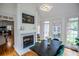 Dining room featuring fireplace, views from windows and access to other rooms, providing a comfortable flow at 213 Shady Valley Dr, Carrollton, GA 30116
