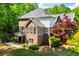 Brick home features a composite deck with a great view of the surrounding mature trees at 213 Shady Valley Dr, Carrollton, GA 30116
