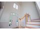 Bright foyer features high ceilings, chandelier, and staircase with wooden railing at 213 Shady Valley Dr, Carrollton, GA 30116