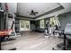 Home gym with multiple exercise machines and ceiling fan at 213 Shady Valley Dr, Carrollton, GA 30116