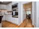 Bright kitchen with stainless steel appliances, granite countertops, and white cabinets with natural light at 213 Shady Valley Dr, Carrollton, GA 30116