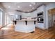 Bright kitchen with stainless appliances, white cabinets, and hardwood floors at 213 Shady Valley Dr, Carrollton, GA 30116