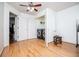 Well-lit laundry room features double doors, washer, dryer and hardwood floors at 213 Shady Valley Dr, Carrollton, GA 30116