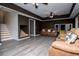 Basement living room with gray floors and unique under-stair space at 213 Shady Valley Dr, Carrollton, GA 30116