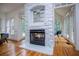 Living room featuring hardwood floors, fireplace, and natural light with access to other rooms at 213 Shady Valley Dr, Carrollton, GA 30116