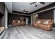 Spacious living room with tray ceiling, recessed lighting, and modern tile floors at 213 Shady Valley Dr, Carrollton, GA 30116