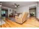 Comfortable living room featuring hardwood floors and open layout to other rooms at 213 Shady Valley Dr, Carrollton, GA 30116