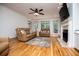 Inviting living room with a cozy fireplace, hardwood floors, and plenty of natural light at 213 Shady Valley Dr, Carrollton, GA 30116