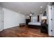 Spacious bedroom features hardwood floors, a ceiling fan, and a window with natural light at 213 Shady Valley Dr, Carrollton, GA 30116