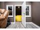 Cozy playroom features a yellow beanbag chair, chandelier and plenty of natural light at 213 Shady Valley Dr, Carrollton, GA 30116