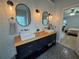 Bright bathroom featuring a double vanity, wood countertop, shiplap walls, and mosaic tile floors at 4080 Longford Ne Dr, Marietta, GA 30066
