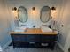 Bright bathroom with double sinks, modern fixtures, and stylish wood-look vanity at 4080 Longford Ne Dr, Marietta, GA 30066