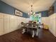 Cozy dining room with custom millwork and a modern light fixture at 4080 Longford Ne Dr, Marietta, GA 30066
