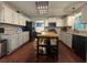Well-equipped kitchen with stainless steel appliances, gray cabinets, and butcher block island at 4080 Longford Ne Dr, Marietta, GA 30066