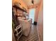 Functional laundry room with washer, dryer, storage shelf and patterned tile flooring at 4080 Longford Ne Dr, Marietta, GA 30066