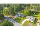 Aerial view of the home showcasing a well-manicured front yard and mature trees at 4166 Idlevale Dr, Tucker, GA 30084