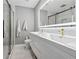 Modern bathroom featuring double sinks, gold hardware, and a glass-enclosed shower with marble tile at 4166 Idlevale Dr, Tucker, GA 30084