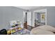 This bedroom has a closet with mirrored doors and shelves for storage at 4166 Idlevale Dr, Tucker, GA 30084