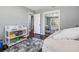 Neutral bedroom with hardwood floors, mirrored closet, and kid storage, providing comfort and organization at 4166 Idlevale Dr, Tucker, GA 30084