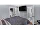 This bedroom features a large television, ensuite bathroom and closet at 4166 Idlevale Dr, Tucker, GA 30084
