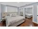Bedroom featuring hardwood floors, neutral walls, and mirrored closet doors at 4166 Idlevale Dr, Tucker, GA 30084
