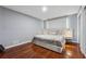 Serene bedroom with hardwood floors, ambient lighting, and a comfortable queen-sized bed at 4166 Idlevale Dr, Tucker, GA 30084