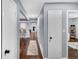 Hallway view showcasing hardwood floors, a neutral color palette, and access to the kitchen area at 4166 Idlevale Dr, Tucker, GA 30084