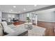 Comfortable living room with hardwood floors, bar seating, and an open floorplan at 4166 Idlevale Dr, Tucker, GA 30084