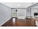 Open floor plan living room featuring hardwood floors, a back door, and neutral wall colors at 4166 Idlevale Dr, Tucker, GA 30084
