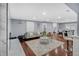 Open living area with hardwood floors, a fireplace, a modern couch, and barstool seating at 4166 Idlevale Dr, Tucker, GA 30084